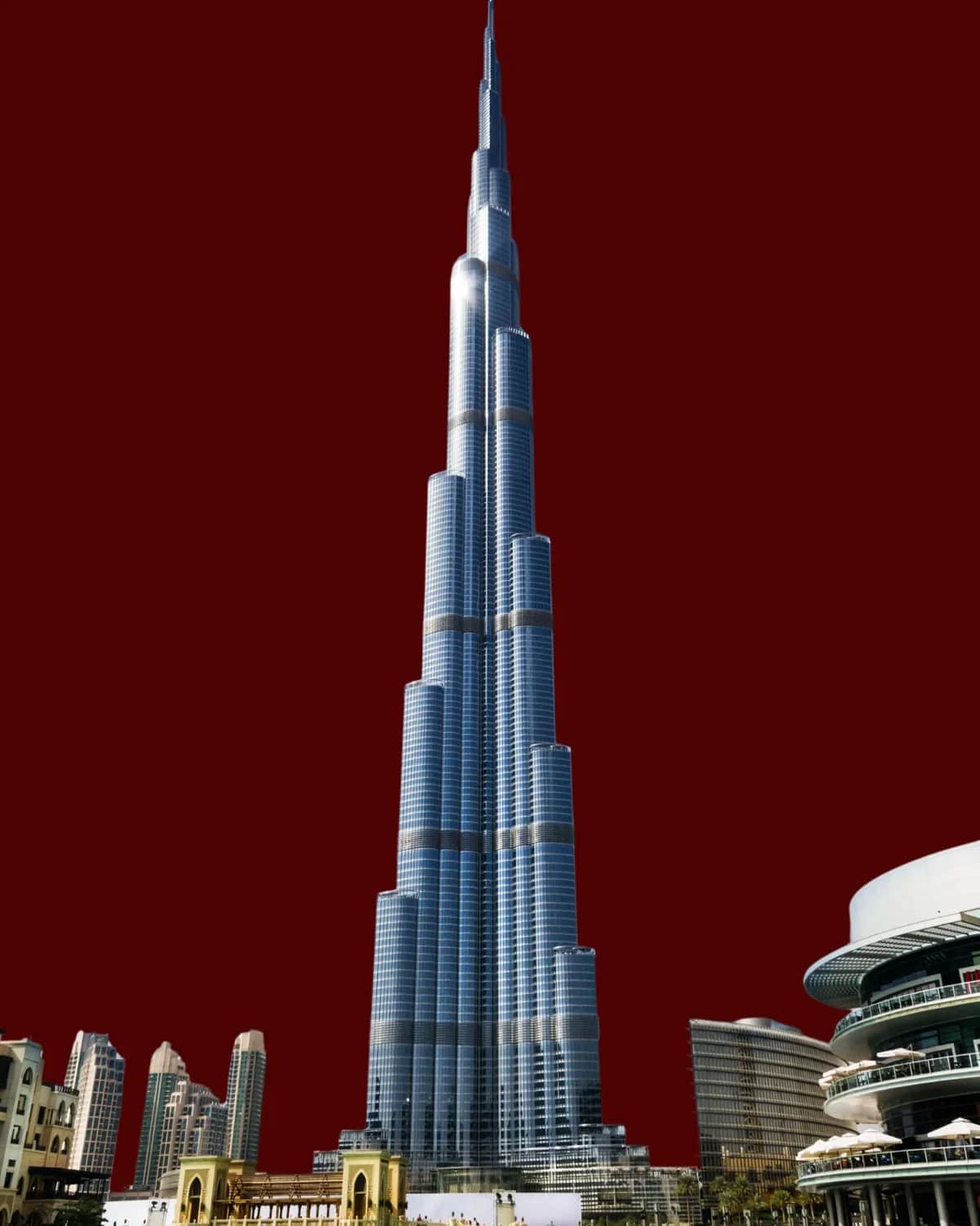 Burj Khalifa and Downtown Dubai on a deep burgundy background